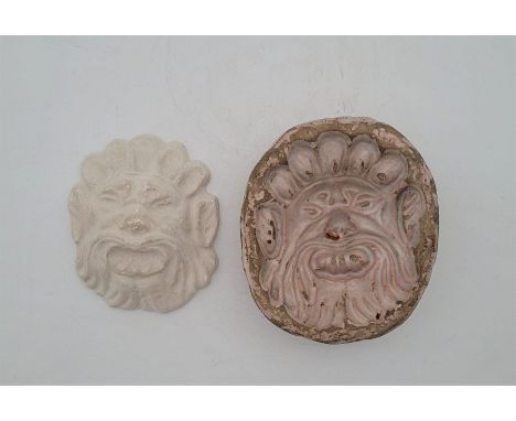 An 18th century English Delftware lions mask mould,&nbsp;undergalze painted ".A.N.", length 12.4cm,&nbsp;