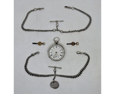 A Victorian silver open faced pocket watch, key wind, having white enamel Roman numeral dial and subsidiary Arabic numeral se