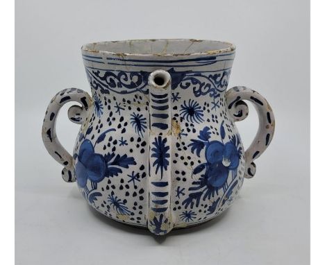 A late 17th/early 18th century English Delftware posset pot, painted in blue, lacking cover, base underglaze painted "W", hei