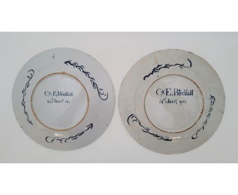 A Pair of 18th century English Delftware marriage plates, painted in green, brown, orange, blue and yellow, each verso underg