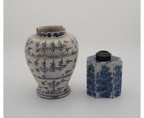 An 18th century English Delftware tea cannister, painted in blue, with associated later metal cover, painted to base "M*R", h