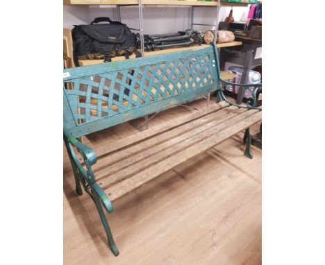 A 2 SEATED WOODEN GARDEN BENCH WITH CAST IRON SUPPORTS