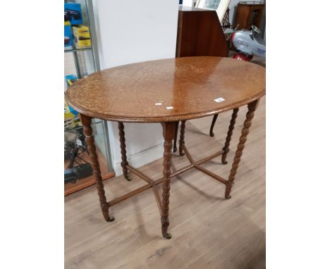 A SATIN WALNUT CENTRE TABLE WITH BOBBIN TURNED LEGS