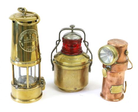 A Fire Service CEAG Copper Flame Proof Lamp, stamped with broad arrow, the lens with brass bezel and with brass wire handle a