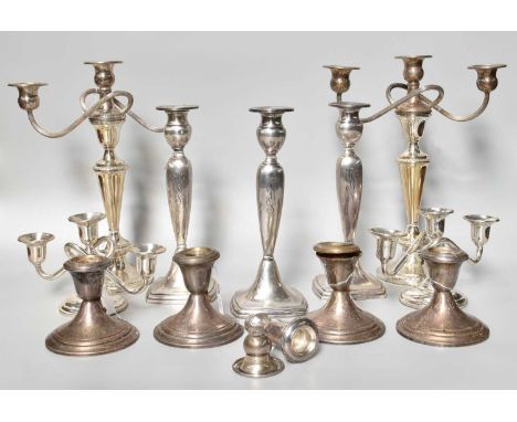 A Collection of American Silver Candlesticks and Candelabra, variously formed, filled (qty)