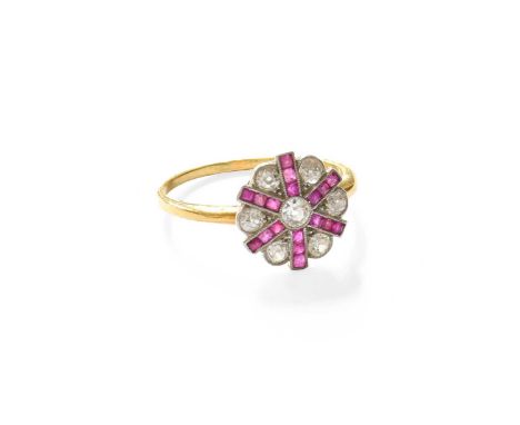 A Synthetic Ruby and Diamond Cluster Ring, indistinctly marked, finger size PThe ring head measures 12.00mm diameter approxim
