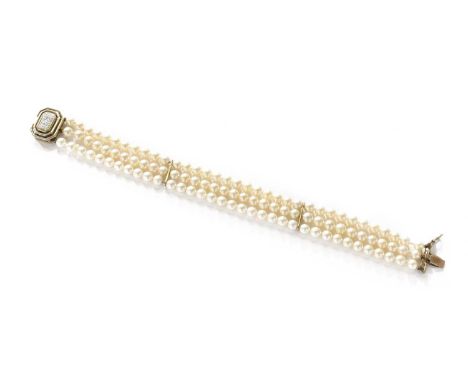 A Cultured Pearl Three Row Bracelet, with diamond cluster clasp, stamped '375', length 18.5cmGross weight 19.5 grams.