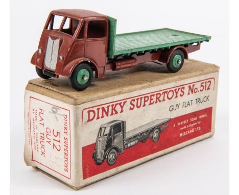 Dinky Supertoys Guy Flat Truck (512). An early example made for 1 year only in 1948. Dark brown cab and chassis with green fl