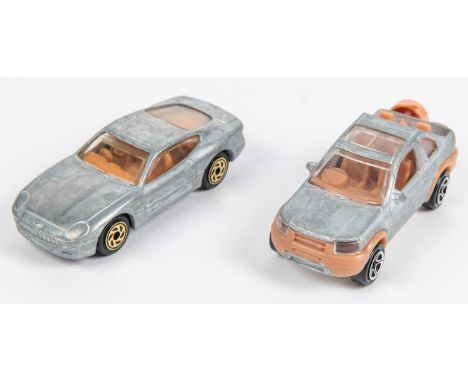 2 Matchbox American pre-production/ First shot castings. An unspun/unassembled 1994 Aston Martin DB7, with gold coloured prod