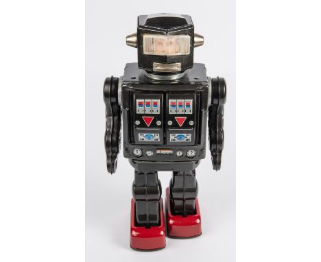 Horikawa Super Astronaut battery powered tinplate Robot. 29cm high, finished in dark metallic grey with red feet, opening che