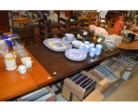 An Old Charm oak draw leaf dining table; and a set four ladder back chairs