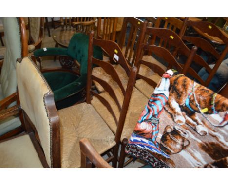 Three oak ladder back and rush seated dining chairs