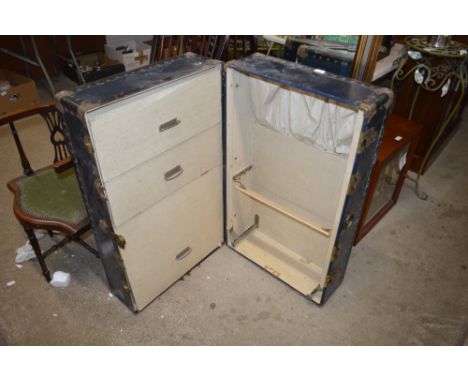 A metal bound cabin trunk