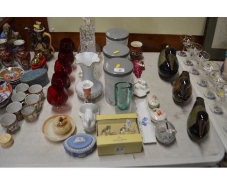 A set of five ruby glass brandy balloons; three ceramic storage jars; a glass decanter; a Wedgwood jasperware pot and cover; 