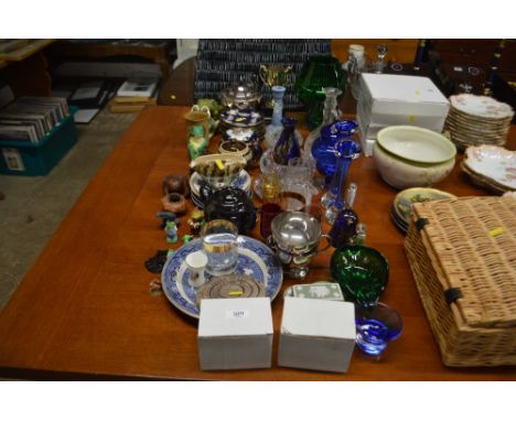 A quantity of various glassware to include a large green glass goblet; silver plated teapot; various decorative china ornamen