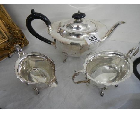 A three piece silver plate tea set.
