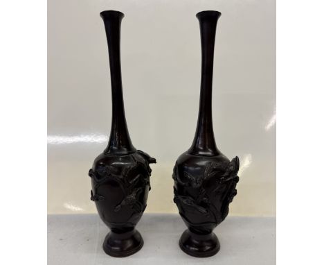 A pair of 19th century Japanese bronze spill vases decorated with birds. Height 28cm