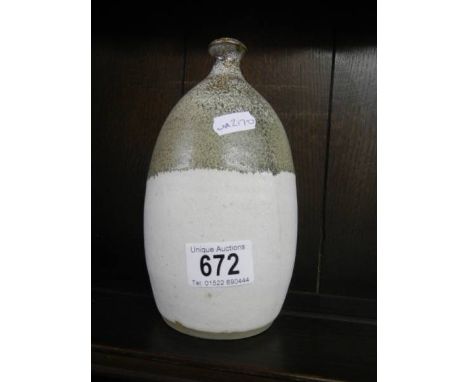 An old stoneware wine flask.