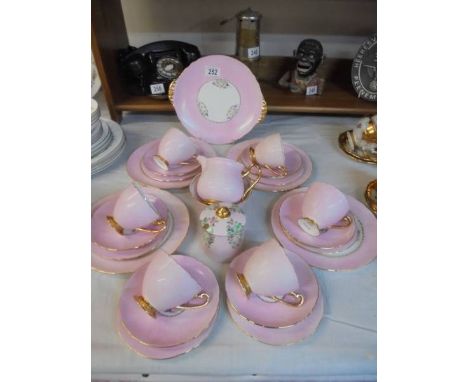 Twenty six pieces of Shelley teaware.21.5cm Plates x 4 are Aynsley all other pieces are Shelley, both brands are identical pa
