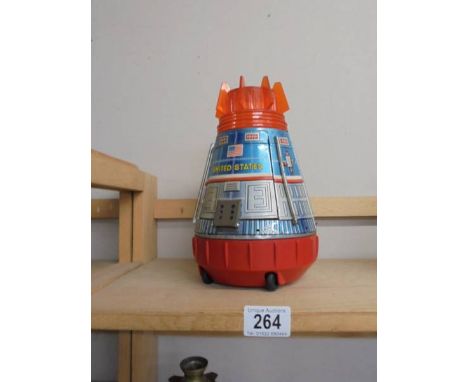 A Japanese tinplate battery operated space capsule by S Horikawa, Japan.