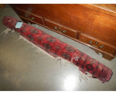 An Afghan red patterned rug (some fraying) 48 x 68 cm.