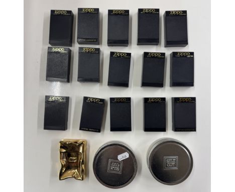 A large quantity of Zippo lighters including 2 silk cut.