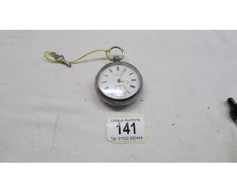 A Fattorini &amp; Sons silver cased pocket watch with key and Waltham movement.