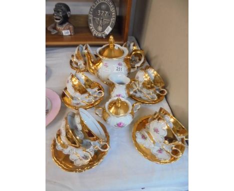 A fine Bavarian porcelain tea set with gold decoration - teapot, sugar bowl, milk jug, 12 cups and 12 saucers.All pieces in g