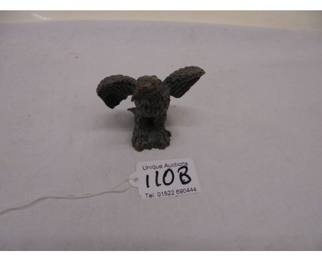 A small bronze eagle.