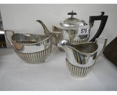 A three piece silver plate tea set.