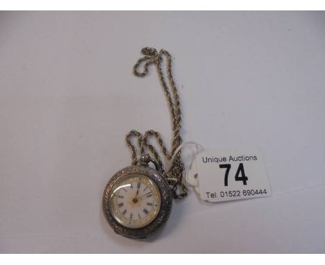 A Victorian ladies silver fob watch on a silver chain.
