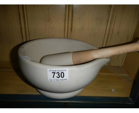 A large pestle and mortar.