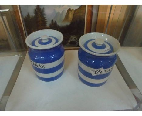 A pair of T G Green Cornish ware storage jars.Peas jar has some staining under lid rim, jar in good condition, black shield m