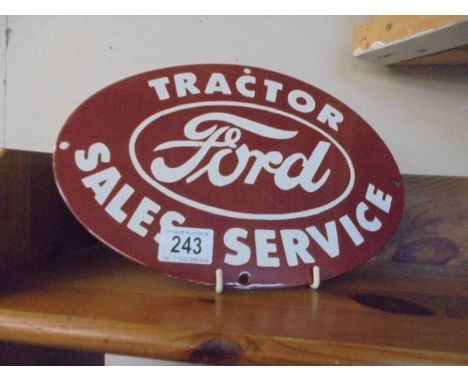 A reproduction 'Ford Tractor Sales service' oval enamel sign, 30 x 20 cm.