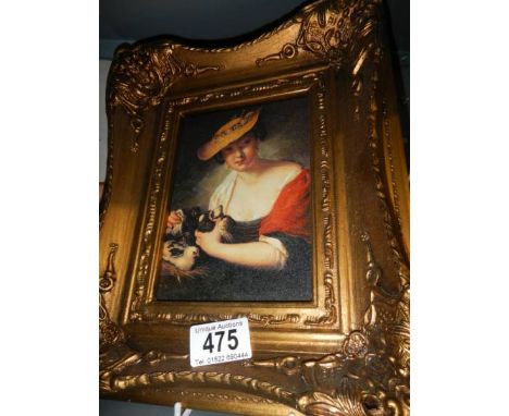 A gilt framed enhanced portrait print of a lady.