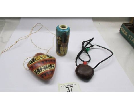 A South American ceramic whistle, a small Chinese vase and another scent bottle.