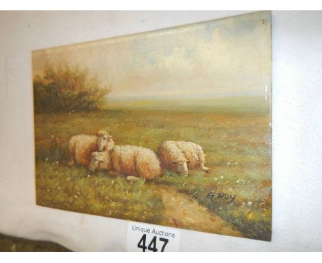A small oil on board painting of sheep, signed G RoySigned G.Roy in good condition. 12.5 x 17.5cm