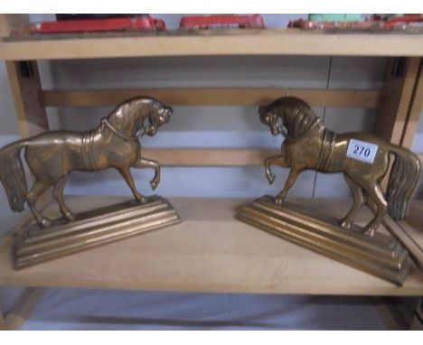 A pair of Victorian bronze horse door stops.