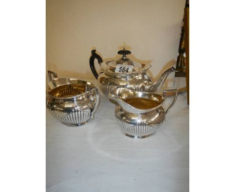 A three piece silver plate tea set.