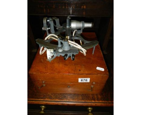 A cased sextant.