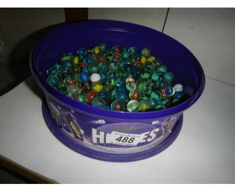 A tub of vintage glass marbles.