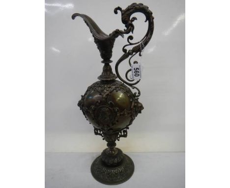 An early bronze ewer decorated with busts and scrolls, possibly continental.