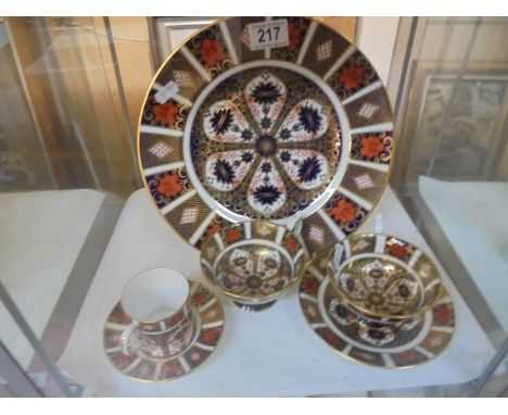 A Royal Crown Derby dinner plates, 2 tea cups, 1 saucer and a coffee cup and saucer.All pieces 1st's and in good condition.