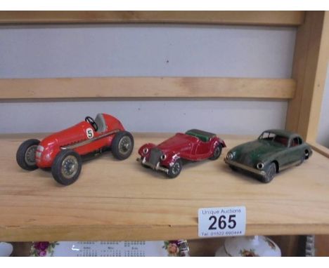 A Scalex Minimodels tinplate Aston Martin, an MGTF and a Schuco Studio 1050 Mercedes.