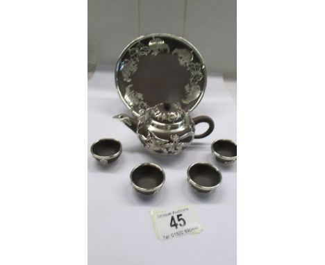 A Chinese tea set on tray.