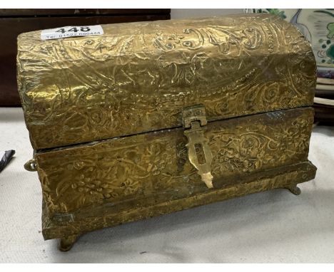 A brass covered dome top casket