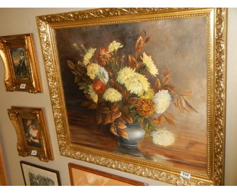 A gilt framed oil on board painting of chrysanthemums signed K M Walker, 1976.