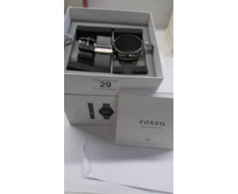 A boxed Fossil Wear OS by Google smartwatch.