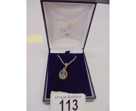 A black opal pendant set in 9ct gold on attached 9ct gold chain, 5 grams.