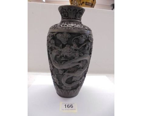 A signed dragon carved black cinnabar vase, 23.5 cm tall.
